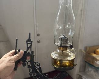 several antique ornate iron lamp brackets in this sale