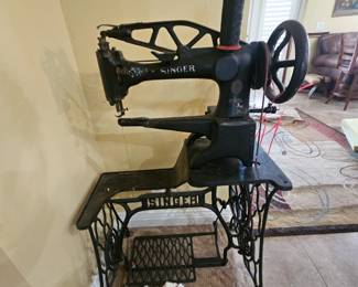 Very old heavy cast iron manual sewing machine