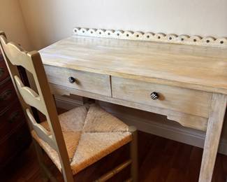 Whitewashed Farmhouse Writing Desk + Woven Ladderback Chair – $145
Beautiful matching set featuring a whitewashed wood writing desk with scalloped trim and a woven ladderback farmhouse chair. The desk has two drawers with fun black-and-white checkered knobs and a distressed finish that gives it French country or rustic cottage charm.
Both pieces are solid, clean, and in excellent condition. Perfect as a writing desk, vanity, or creative corner in a bedroom or guest space.