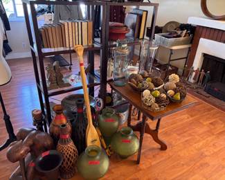 Global-inspired decor, wood carvings, vases & natural accents.
