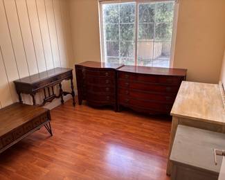 Curated vintage furniture room — antique dressers, writing desk, coffee table & more.