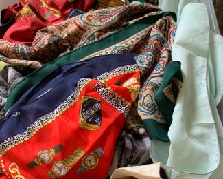 A large bin of designer scarves