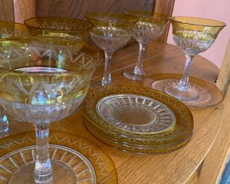 Fancy glass dessert service with yellow rims