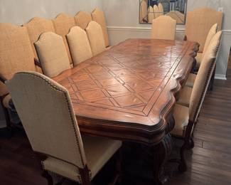 Table accommodates 14 chairs and comes with two leafs to add.