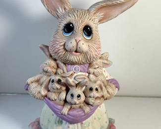 Mother Rabbit Holding Lots of Bunnies