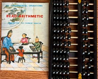 "The Fundamental Operations in Bead Arithmetic: How to Use the Chinese Abacus" with Black and Gold Abacus