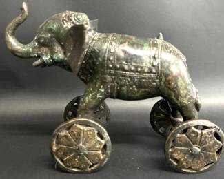 Brass elephant on wheels
