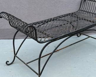 Black iron scrolled arm bench