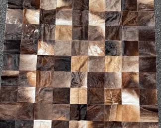 Patchwork hair on hide area rug