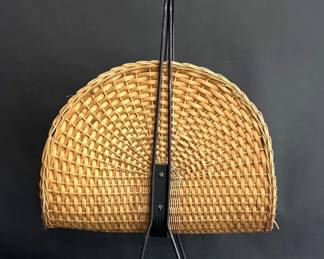 Vintage raffia newspaper rack