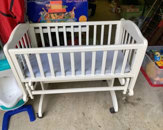 #81 Laminate White Cradle that Rocks on Wheels - 38x42x31 $30.00
