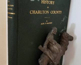 A pair of Egyptian Revival Brass Bookends of Arabian Man on Camel by Hubley with a Book History of Charlton County.