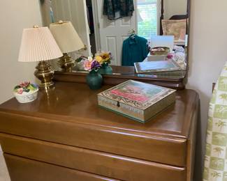 Solid wood dresser with mirror. There is a matching one in the garage that is longer with no mirror and a chest size one in the master closet.