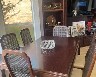 Formal dining table with six cane back chairs