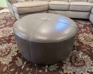 Round Gray Faux Leather Ottoman