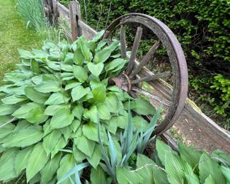 Assorted vintage wooden and metal wagon wheels