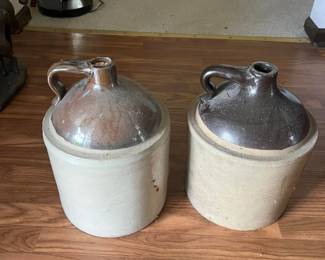 vintage ceramic jugs with glazed tops and handles, rustic stoneware style.