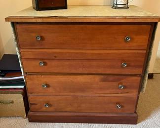 Vintage four-drawer wood dresser with round metal pulls