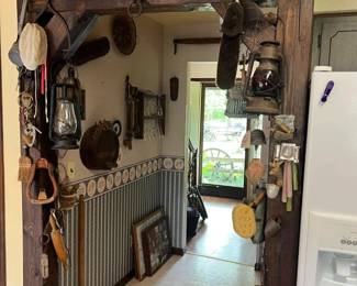 mounted antiques, yoke, horseshoes.
Includes vintage oil lanterns, cast iron tools, hand-carved utensils, leather tack, wood mallets, bells, and early American kitchen gadgets.