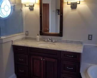 Bath vanity; antique mirror; vanity lights