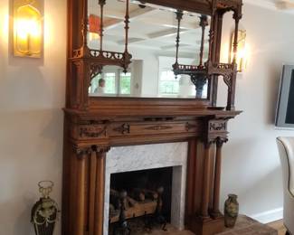 Spectacular mirrored fireplace surround; wall sconces