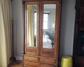 Mirrored armoire