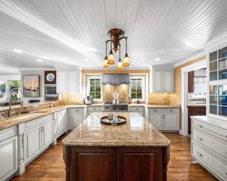 Chef's gourmet kitchen with extensive upper and lower cabinetry