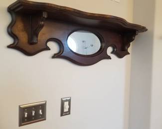 Mirrored wall shelf