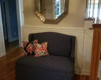 Upholstered settee; wall mirror