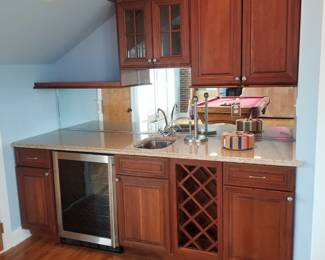 Built-in cabinetry - wet bar with undercabinet wine cooler