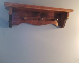 Wall rack with pegs