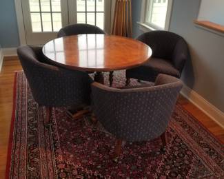 Gaming table seats 4; oriental rug