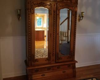 Mirrored armoire; wall sconces