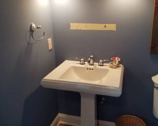 Pedestal sink; wall sconce lights