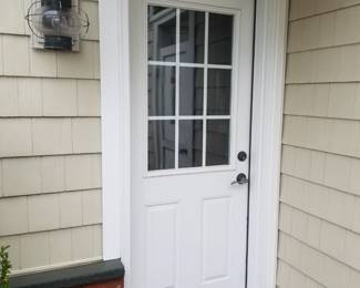 Entry door; exterior light fixtures