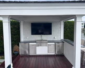 LYNX outdoor kitchen: refrigerator; trash receptacle; sink; cupboard; refrigerator