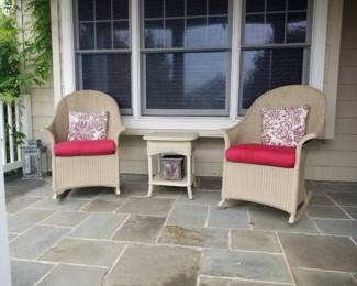 Lloyd & Flanders rocking chairs; accent table
