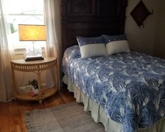 Victorian bed; demilune table; table lamp
