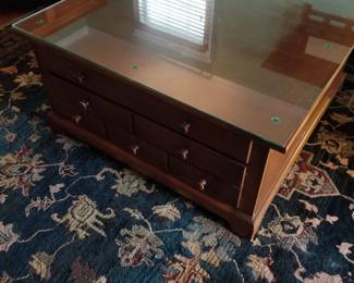 Coffee table with drawers; rug