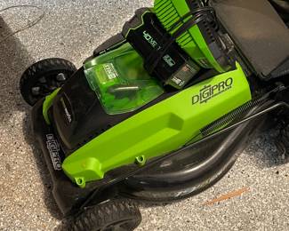Battery powered mower with two batteries, both charged and ready for your yard!