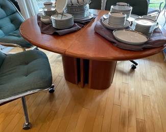 Skovby dining table - Danish Modern teak. Butterfly leaf sets in middle column of table.