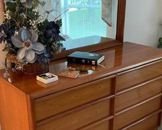 Set includes dresser with mirror, twin beds and a chest of drawers.