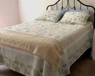 Full Size Bed With Metal Headboard and Bedding