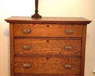 Antique Wooden Chest Of Drawers On Casters With Lamp