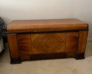 Art Deco Cedar Chest – Ornate veneer pattern, decorative trim.