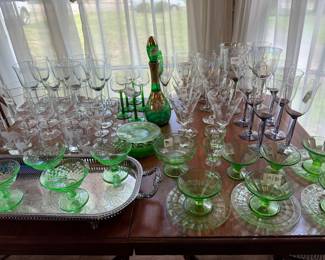 Green depression glass and assorted wine stems