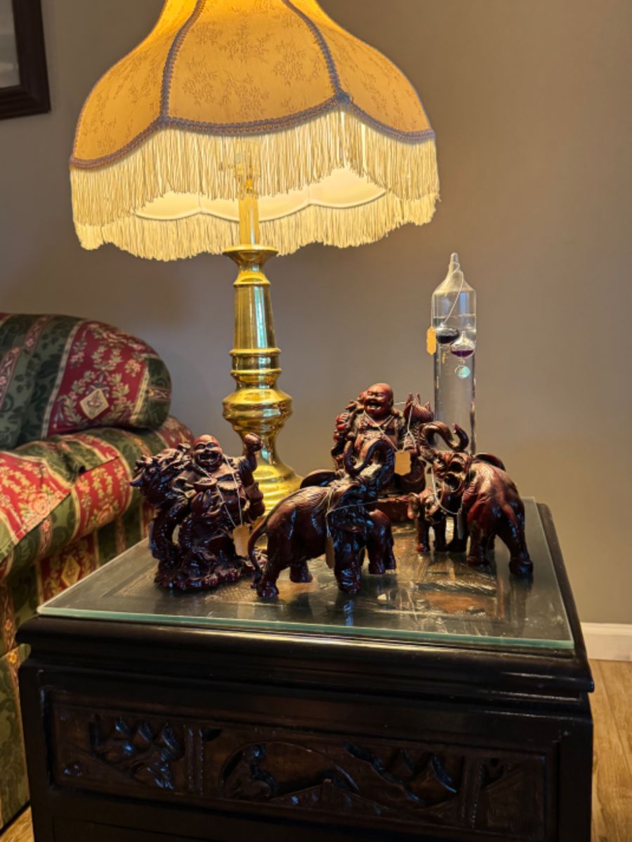 Buddha and elephant carved figures, Galileo thermometer
