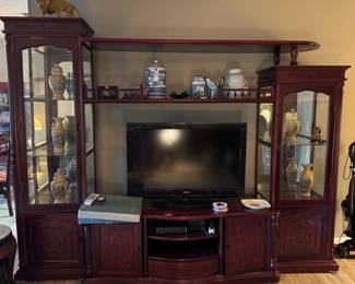 Media center with shelves and glass display curio cabinets. Approximately 8'11" Lx 7'9"H