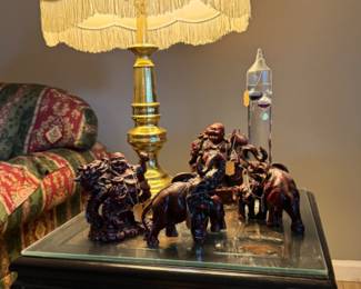 Buddha and elephant carved figures, Galileo thermometer