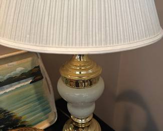 white and gold lamp with lampshade, seashells for decor